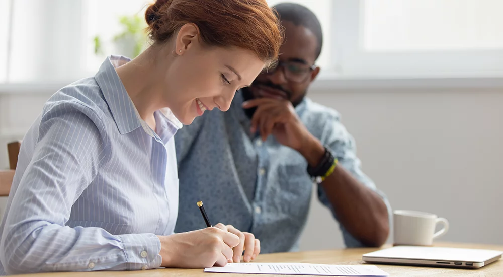 Woman filling out paperwork.