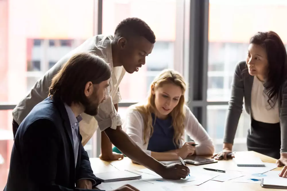 A small business team discusses their reports.